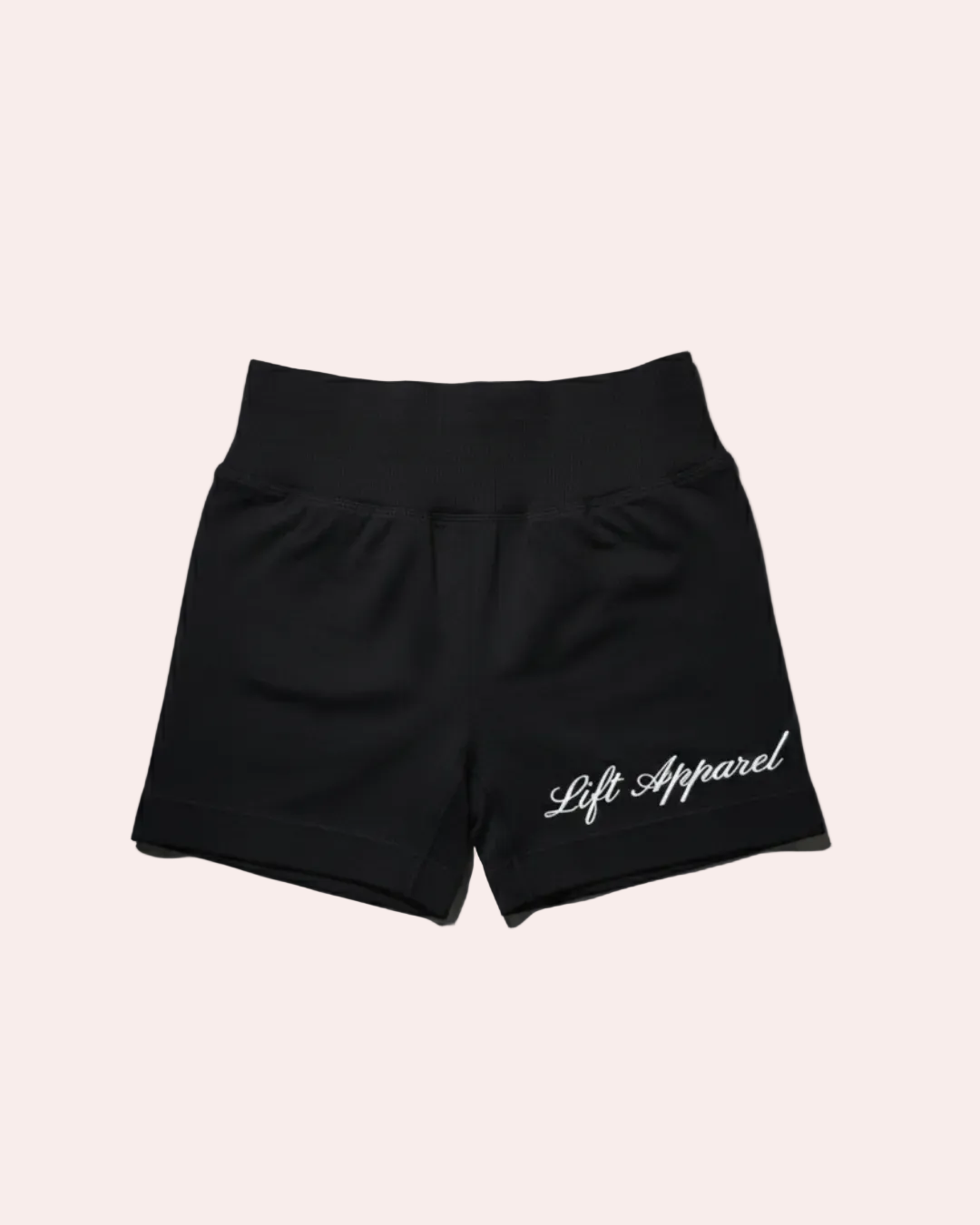 Black shorts with 'Lift Apparel' logo on a gray background