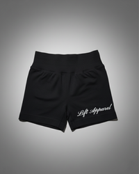 Black shorts with 'Lift Apparel' logo on a gray background