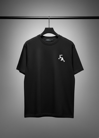 Black t-shirt with a logo on a hanger against a gray background