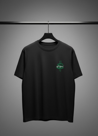 Black t-shirt with a green logo on a hanger against a gray background