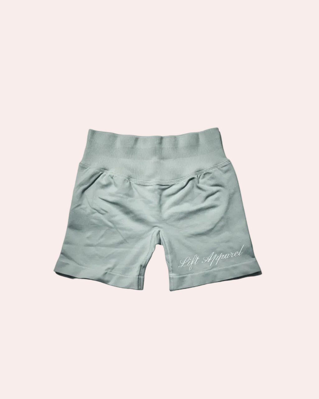 Light blue shorts with 'Lift Apparel' branding on a gray background