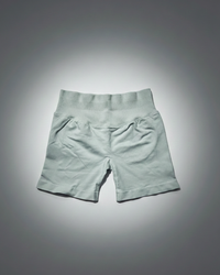Light gray shorts on a gradient gray background