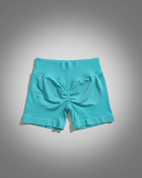 Turquoise shorts on a gray background