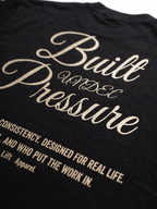 Black t-shirt with gold text on a plain background