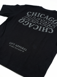 Black t-shirt with 'Chicago Illinois' text and coordinates on a white background