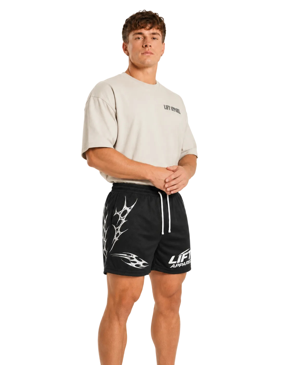Side view of black Apex training shorts with white tribal print and white drawstring waist