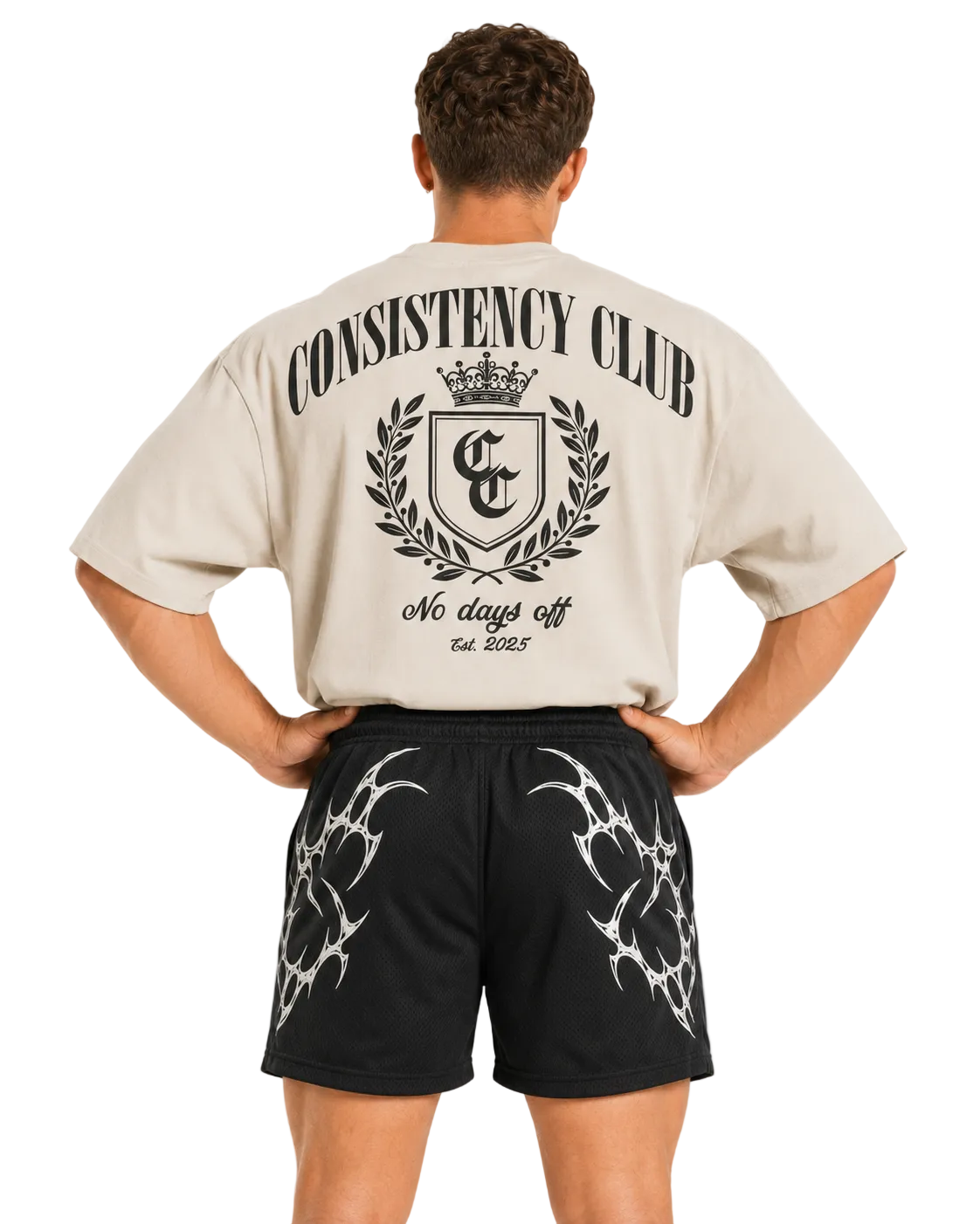 Back view of black Apex training shorts paired with a cream Consistency Club tee