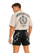 Back view of black Apex gym shorts worn with a cream Consistency Club oversized tee