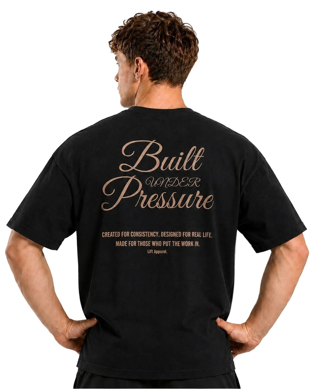 Close-up back view of the black Pressure tee with gold Built Under Pressure lettering