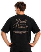 Close-up back view of the black Pressure tee with gold Built Under Pressure lettering