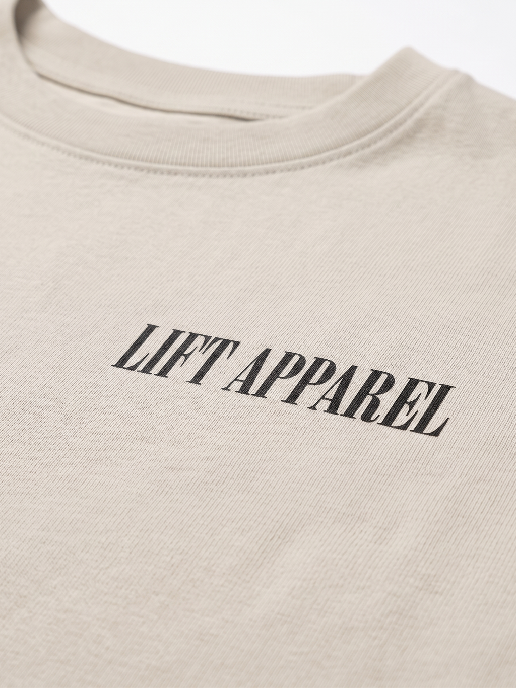 Beige sweatshirt with 'LIFT APPAREL' text on a white background