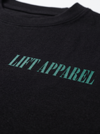 Black garment with 'LIFT APPAREL' printed in green on a white background