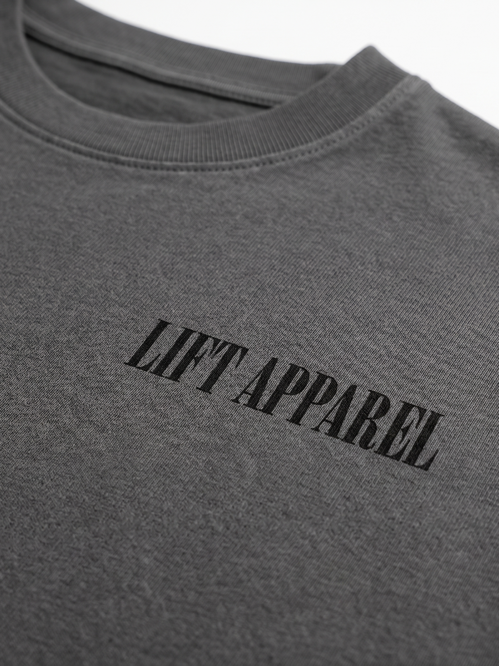 Gray sweatshirt with 'LIFT APPAREL' text on a white background