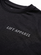 Black garment with 'LIFT APPAREL' logo on a white background
